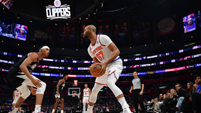 New York Knicks center Taj Gibson (67) controls the ball against Los Angeles Clippers guard Brandon Boston Jr. (4) during the second half at Crypto.com Arena.